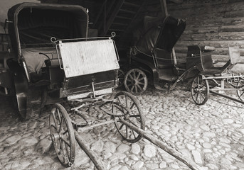 Fototapeta na wymiar Empty vintage coaches stand in garage