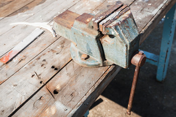 Old vice mounted on a workbench, close up