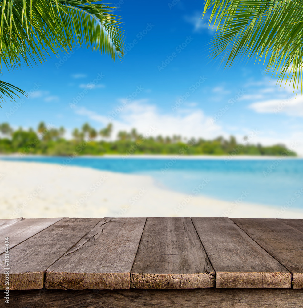 Wall mural empty wooden planks with blur beach on background