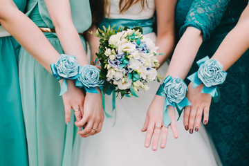 Blue and aqua wedding dresscode. The bride with a white bouquet of roses and bridesmaids in blue...