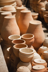 Fototapeta na wymiar Huge roasted ceramic pots without glaze storage