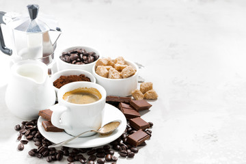 fresh coffee, chocolates and sweets on white background
