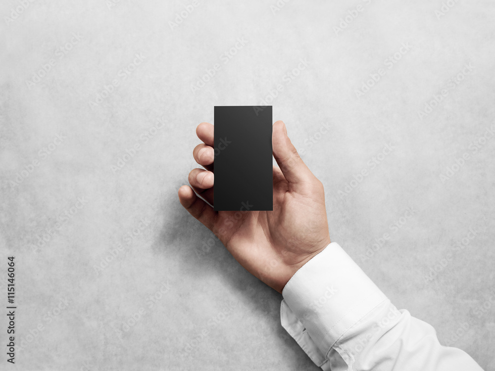 Poster hand holding blank vertical black business card, design mockup. clear calling card mock up template 