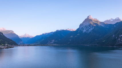 Mmountain range of the Alps. Foehn wind over the lake.  Grandiose volumetric  panorama.