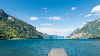 Uri. Mountain range of the Alps. Foehn wind over the lake.  Grandiose volumetric  panorama.