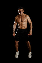 Fototapeta na wymiar 40s hispanic sport man and bodybuilder in gym corporate pose with naked torso muscular body