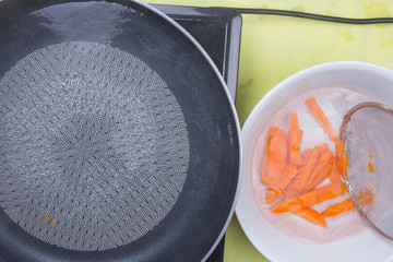 Chef scald carrot with hot water