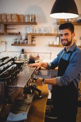 Man taking coffee from espresso machine
