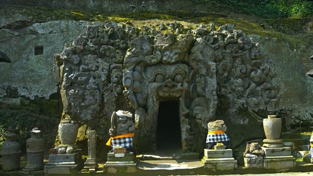 Intricately Carved Entryway to an underground, temple cave at Tirta Empul Temple in Bali, Indonesia. Video UltraHD