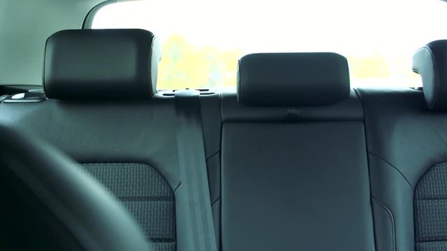 Slowmotion view on backrest of back seats in car