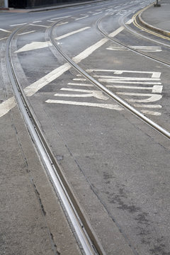 Tram Tracks and Arrow Sign on Street in Nottingham