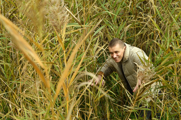 Man walking in autumn forest