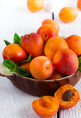 Naklejka na ściany i meble Ceramic bowl with organic ripe apricots