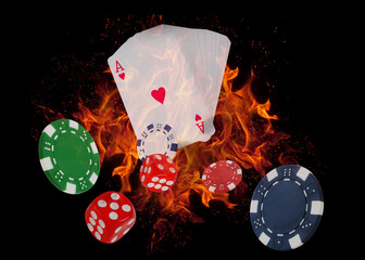 Playing cards and casino chips on fire. poker concept