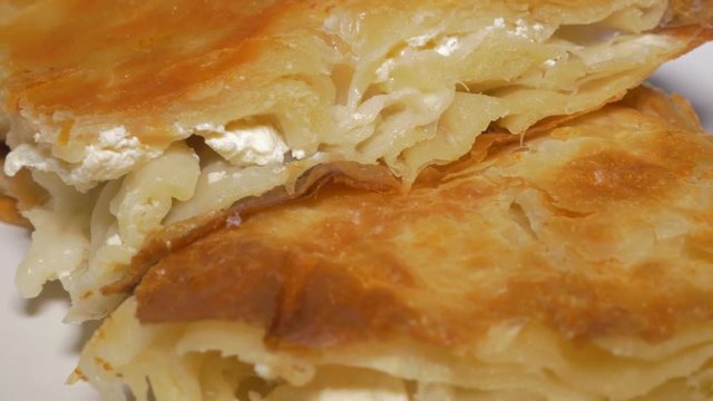 Burek Serbian well known fast food made from dough and cheese 4K 2160p UHD video - Burek traditional breakfast meal in Serbia 4K 3840X2160 UHD footage 