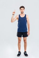 Full length portrait of a sportsman showing up on something