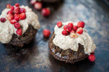 Mini chocolate bundt cake with cheese cream and strawberries