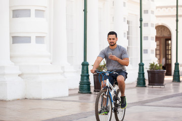 Man riding a bike and texting