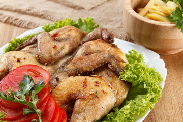 Chicken fried with potato and vegetables