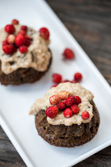 Mini chocolate bundt cake with cheese cream and strawberries