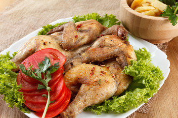 Chicken fried with potato and vegetables