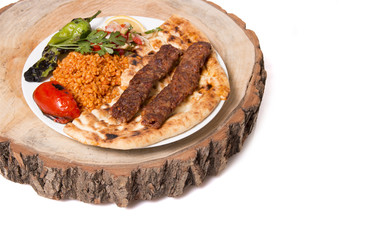 adana kebab and timber background