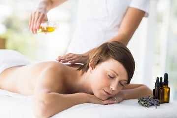 Relaxed woman receiving massage treatment