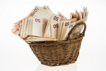 Fifty euro banknotes pile. Money bunch stack. Bill and brown basket on white background. Euros heap