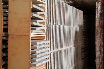 Just fired red bricks out of the kiln of a brick workshop