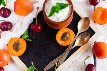 Fresh jogurt with organic ripe apricots and cherries