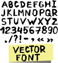 Handwritten alphabet written with brush pen.