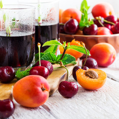 Organic ripe apricots cherries and fresh juice