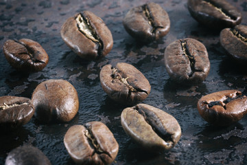 Vintage photo of coffee beans on a stone background