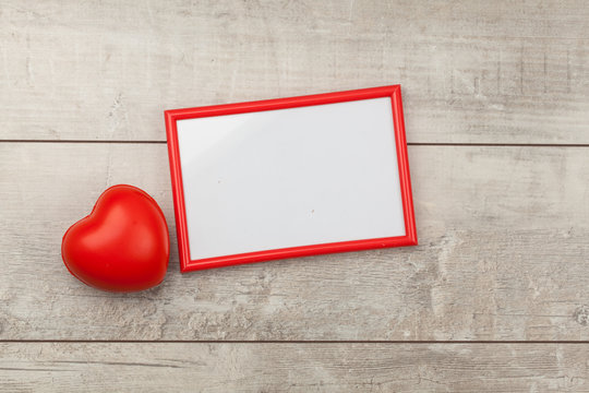 Red Photo Frame On Wood Table