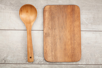 Wooden kitchen spoon on wood table