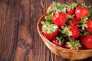 fresh strawberries in a basket on table