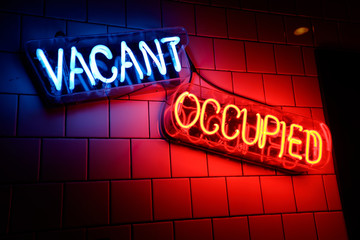 neon signs light up a wall