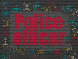 Law concept: Police Officer on wall background