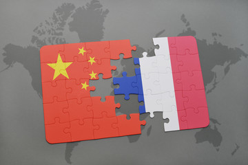 puzzle with the national flag of china and france on a world map background.