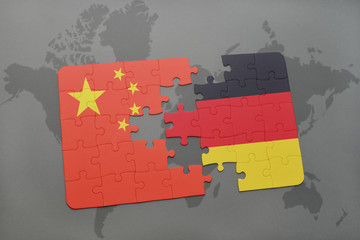 puzzle with the national flag of china and germany on a world map background. © luzitanija
