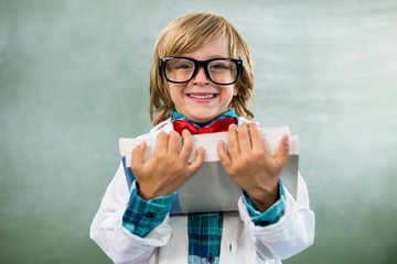 Portrait of boy dressed as scientist in classroom - obrazy, fototapety, plakaty