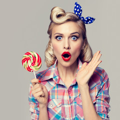 beautiful woman with lollipop, dressed in pin-up style