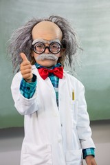 Boy dressed as scientist with thumbs up sign - obrazy, fototapety, plakaty