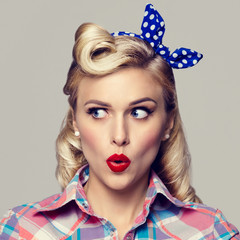  young surprised woman, dressed in pin-up style