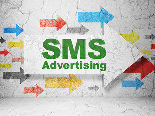 Advertising concept: arrow with SMS Advertising on grunge wall background