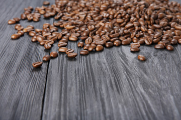 Coffee beans on wood background