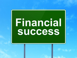 Money concept: Financial Success on road sign background
