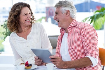 Cheerful couple in restaurant