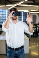 Businessman using virtual reality simulator