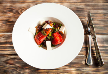 tasty tomatoes warm salad cheese and mushrooms